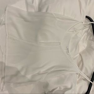 Boutique plain white tank top small slit in front